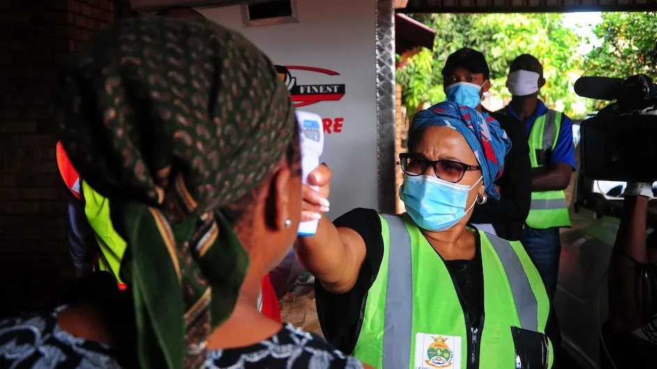 
Community healthcare workers conduct door to door screening for COVID-19 in South Africa. Photo credit: Mukurukuru Media/Shutterstock